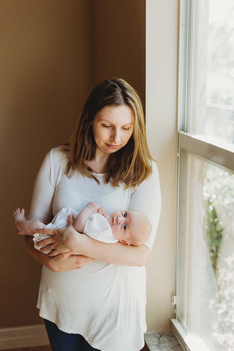 Fort Myers Lifestyle Newborn Photography Mom and Baby at Window